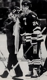 Chris Kotsopoulos and trainer Tom Woodcock help an injured Whaler