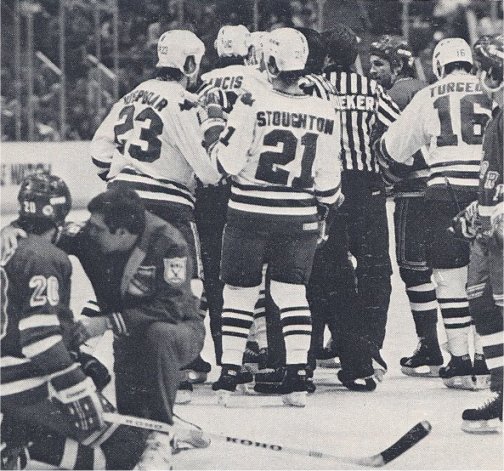 Ed Hospodar elbows Jan Erixon of the New York Rangers causing a bench clearing braw on November 26th 1983