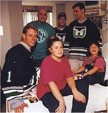 Gerald Diduck, Andrew Cassels, and Sean Burke visit friends at Yale-New Haven Hospital