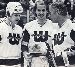 Marty and Mark Howe present Gordie with a gold puck commemorating his 1,000th career goal