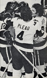 Mike Byers, Larry Pleau, and Jim Dorey celebrate a goal