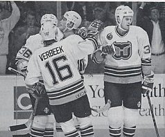 Murray Craven, Pat Verbeek, Michael Nylander, and Zarley Zalapski celebrate a goal