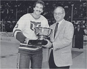 Joel Quenneville accepts the 1984 Budweiser Most Valuable Defenseman award